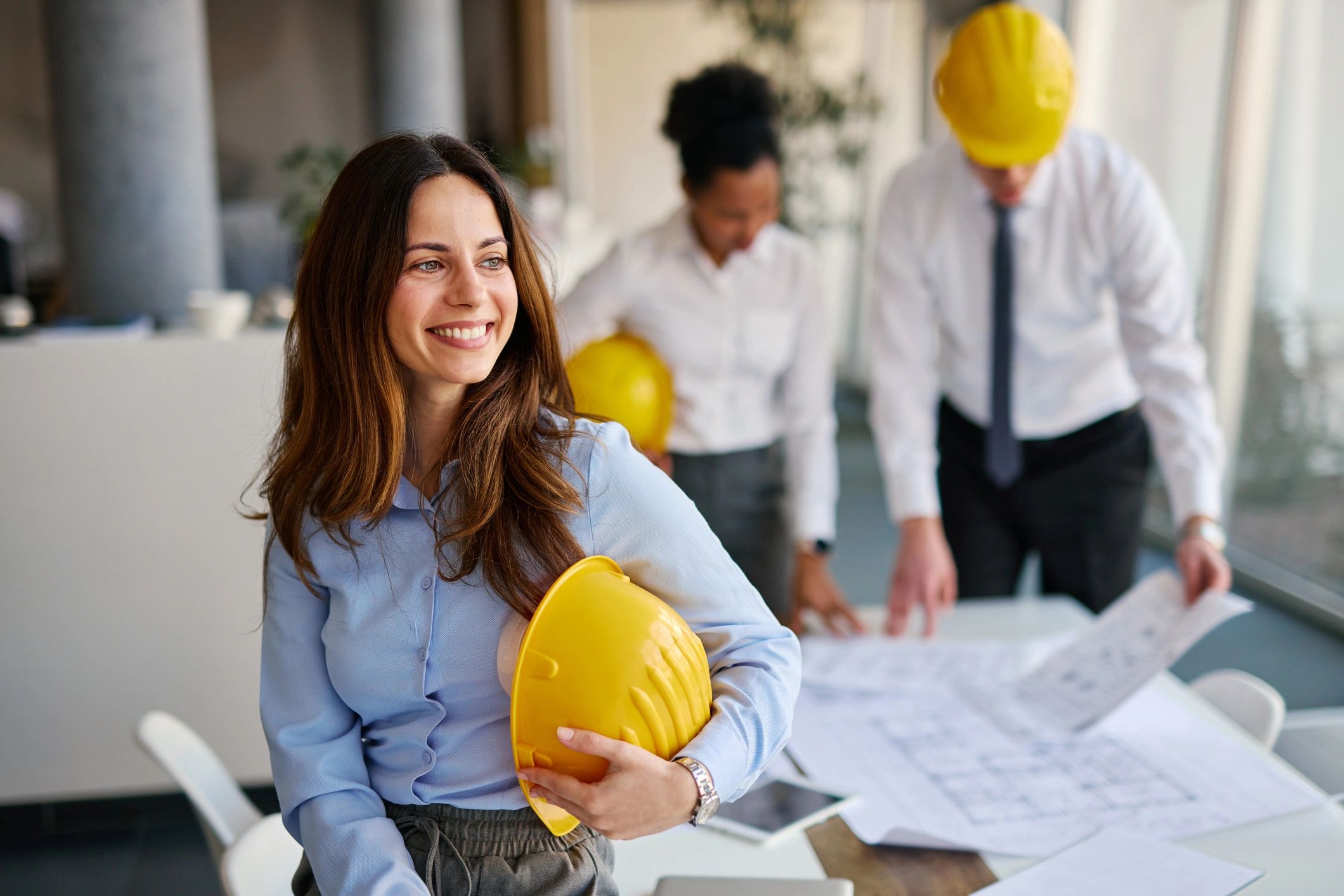 Architect holding a safety helmet