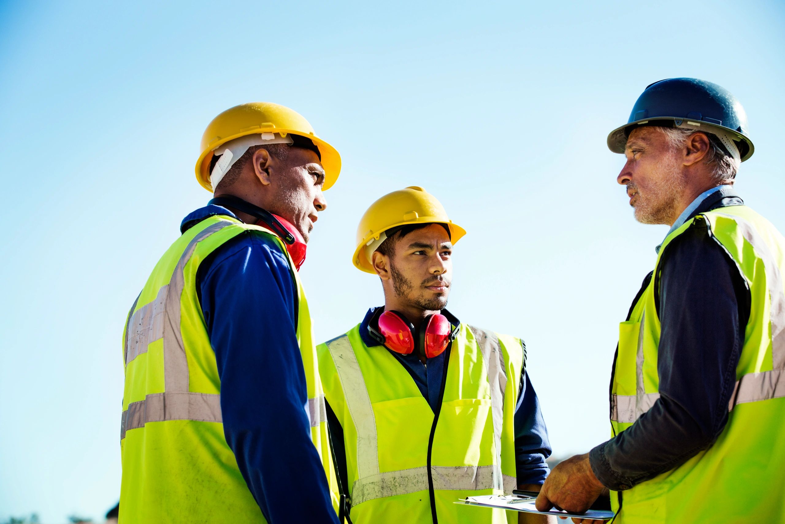 Architect discussing with workers on site